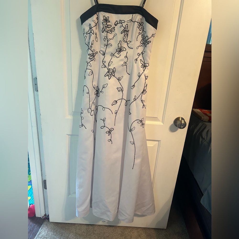 Morgan & Co. strapless white gown with black trip and black beading